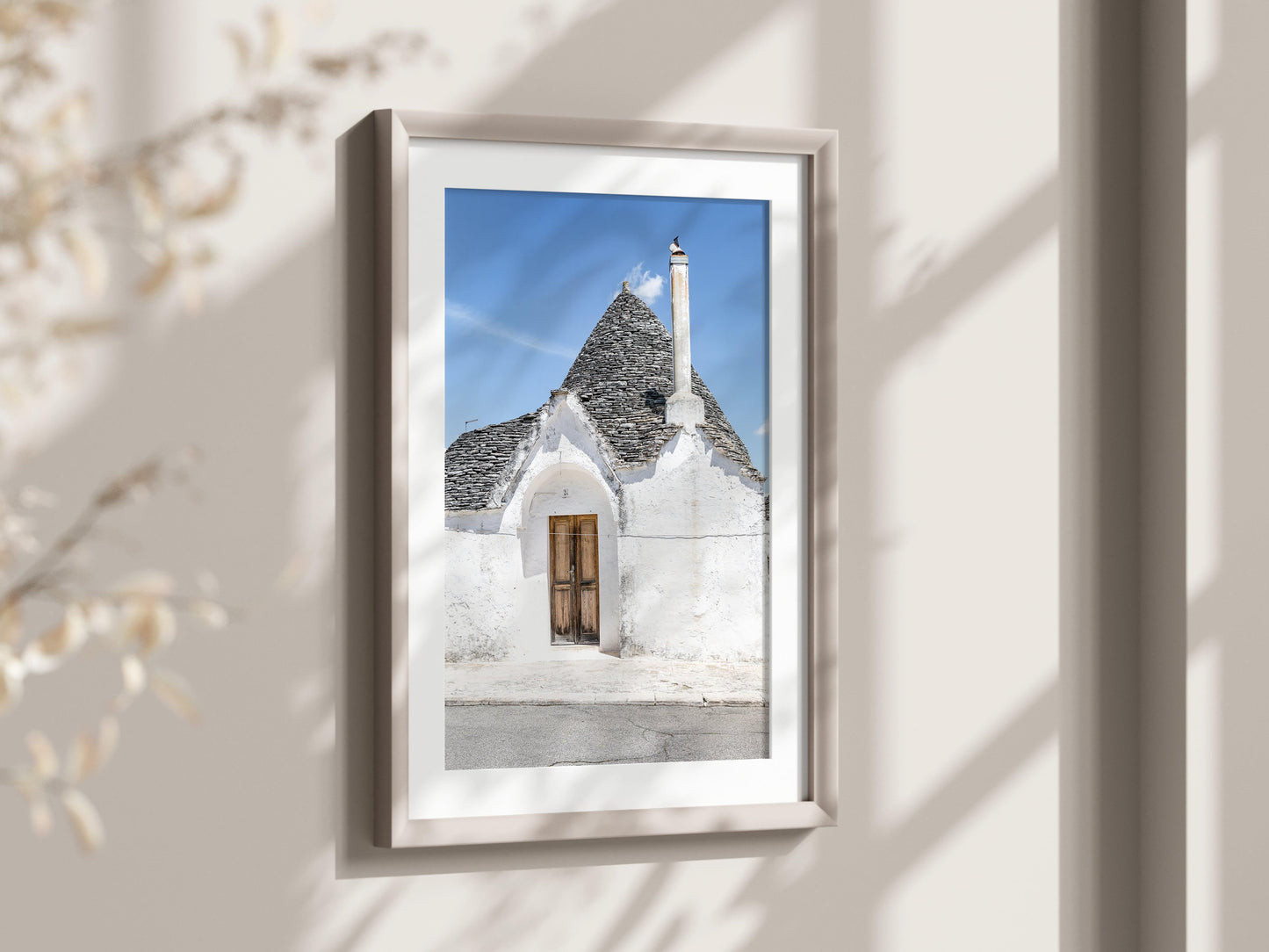 Vertical photo of trullo doorway and rooftop in Alberobello, Italy with stucco walls and blue sky – Mediterranean wall art