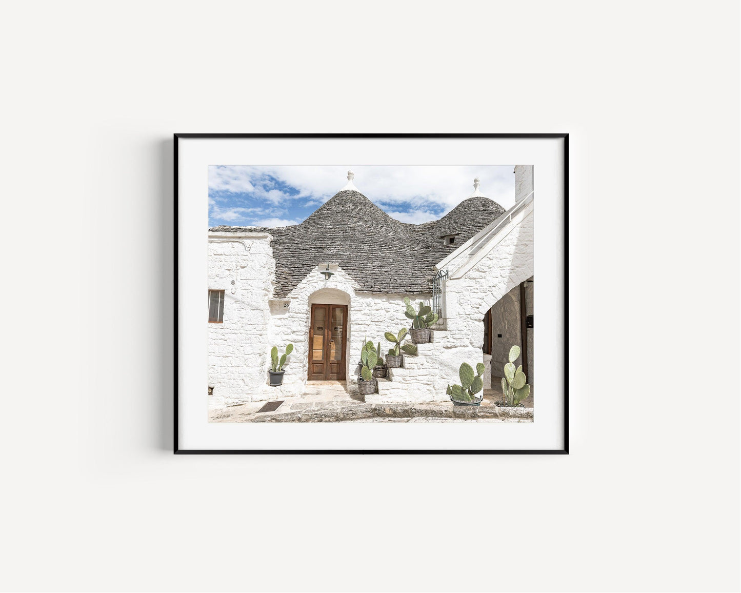 Horizontal photo of trulli rooftops and stone walls in Alberobello, Italy – Mediterranean architectural print