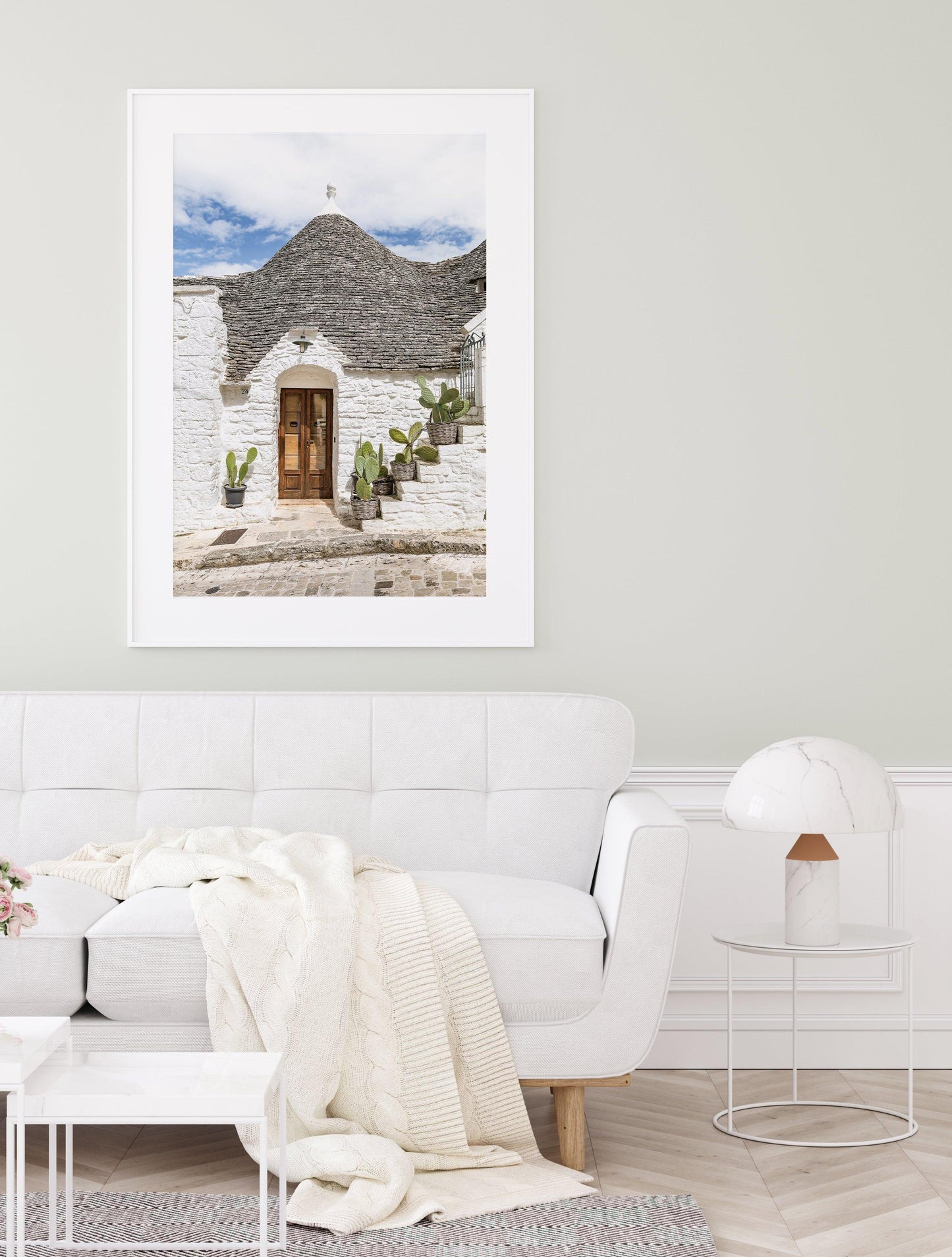 Vertical photo of trullo house in Alberobello, Italy with potted cactus and textured white stone walls – Mediterranean architectural print
