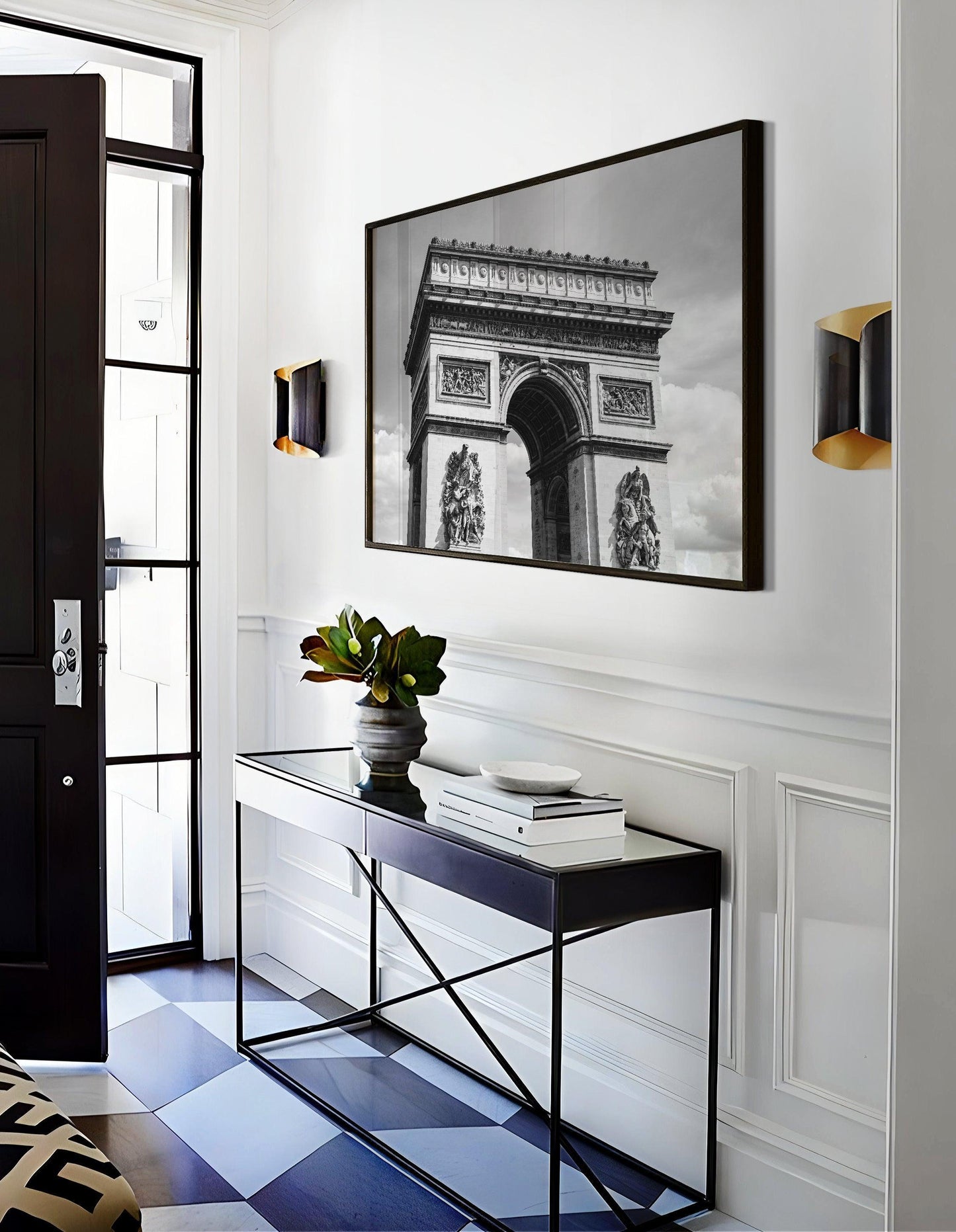 Black and white photograph of the Arc de Triomphe in Paris, taken from the Champs Elysées with strong architectural lines and soft contrast.