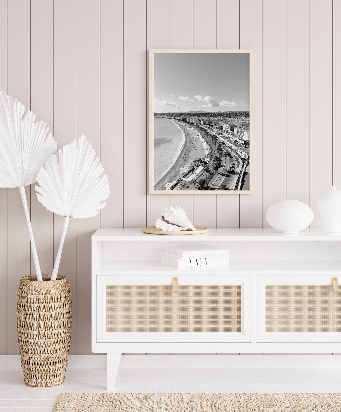 Black and white photograph of the Nice, France skyline featuring coastal views and architecture.