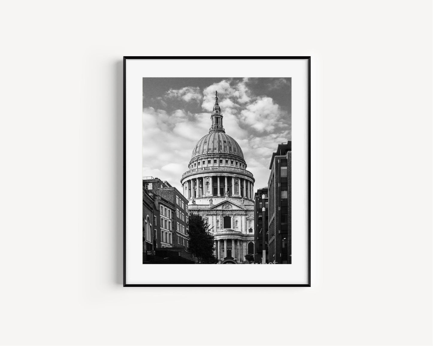 St. Paul’s Cathedral in London, featuring the domed structure and grand architecture in black and white.