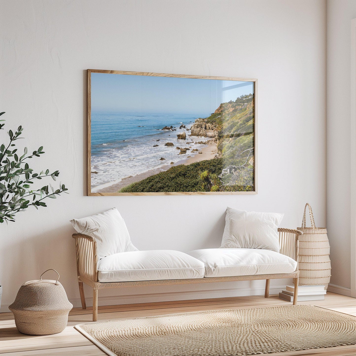 Horizontal coastal photo of El Matador State Beach in Malibu with cliffs, rocks, and ocean waves