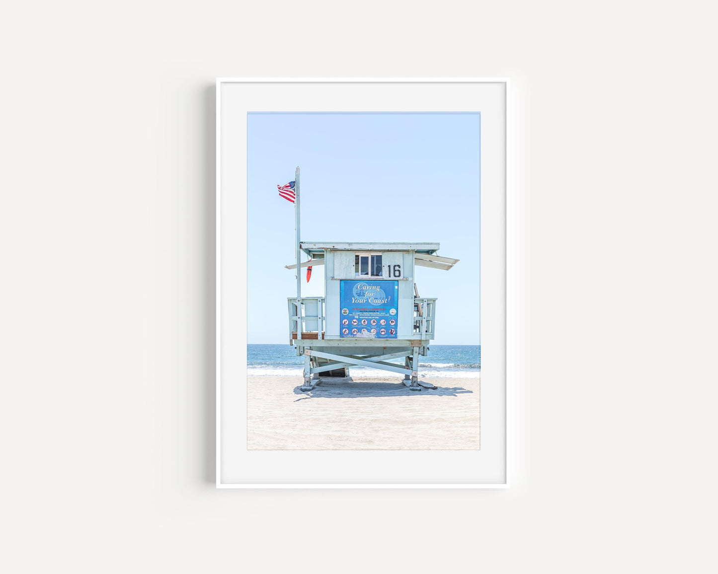 California lifeguard tower 16 in front of the ocean with clear sky – vertical coastal photography print
