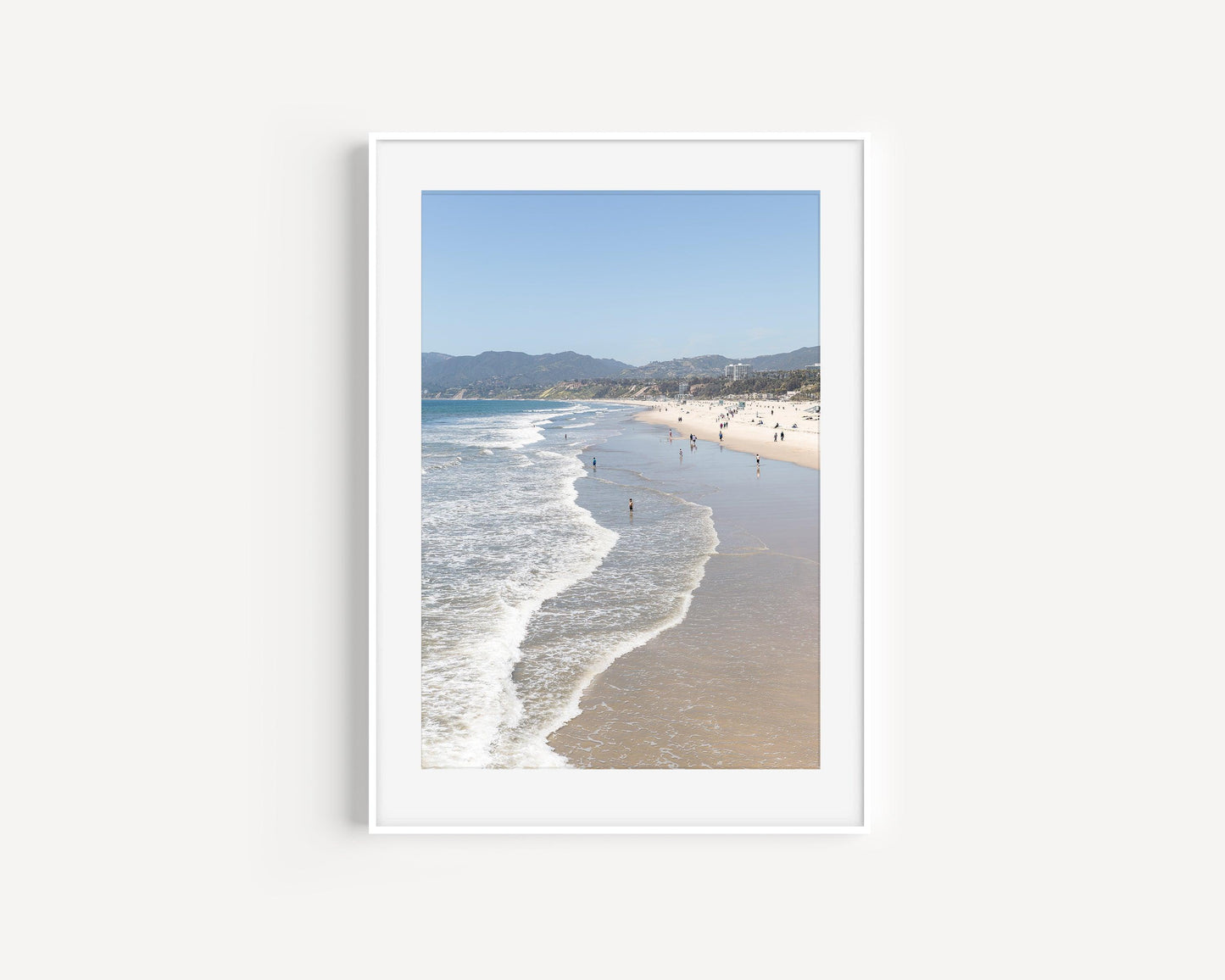 Vertical beach photo of Santa Monica with ocean waves, soft sand, and distant hills – California coast wall art