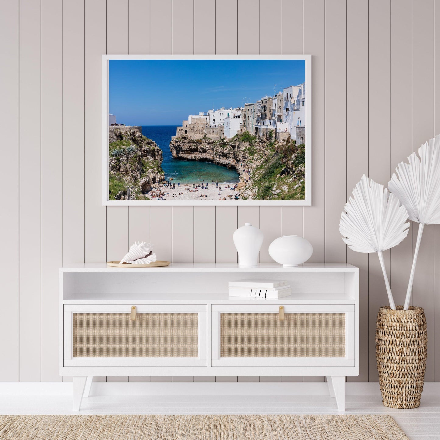 Turquoise waters and limestone cliffs in Polignano a Mare, Italy.
