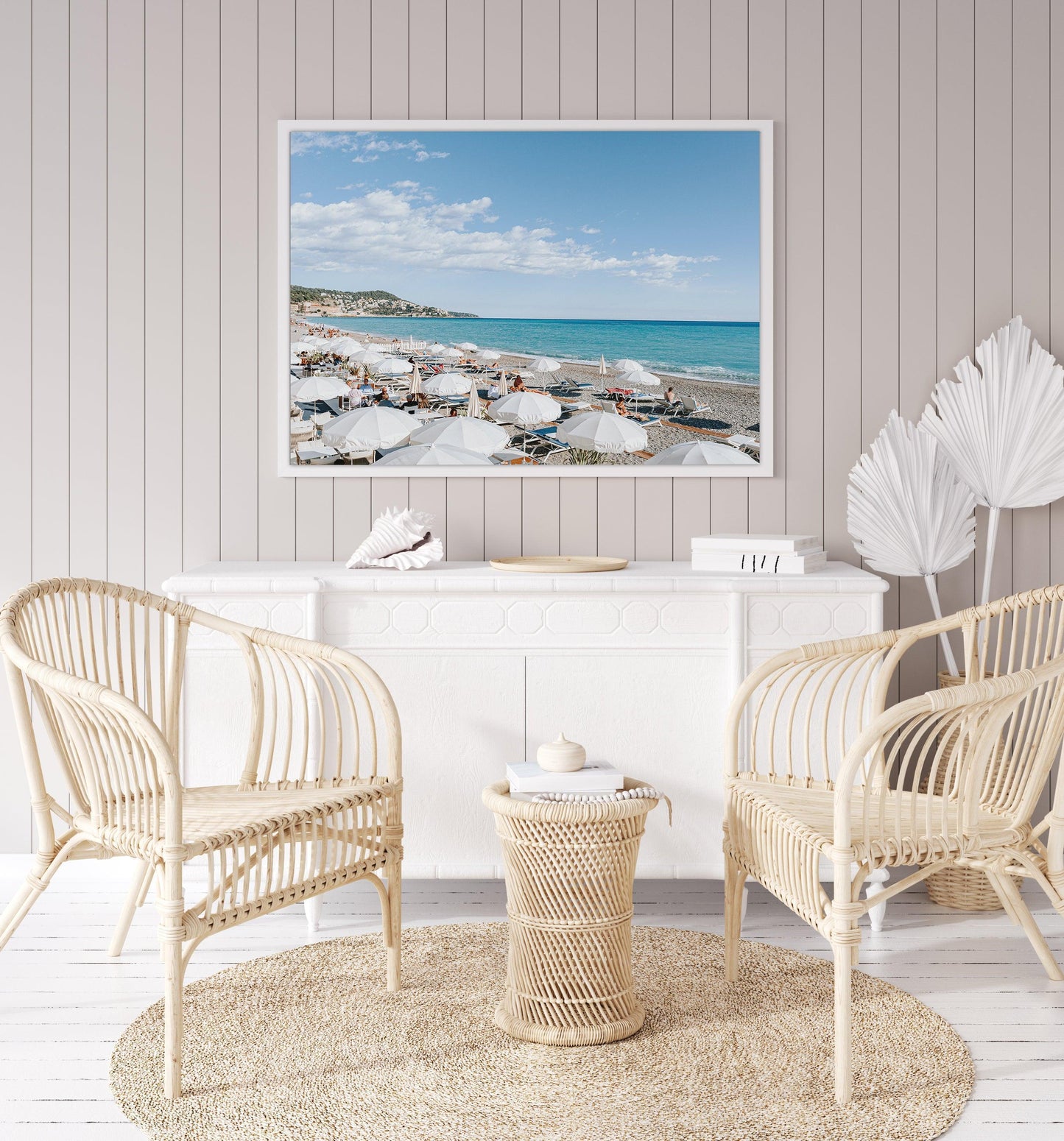 Nice, France beach umbrella print featuring white umbrellas along the coast. Coastal French Riviera wall art in horizontal format, ideal for bright and modern interiors.