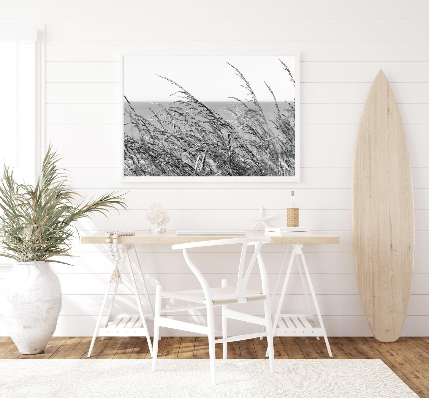 Black and white photo of tall sea oats set against a clear sky, captured on a quiet coastal day near Charleston, South Carolina.