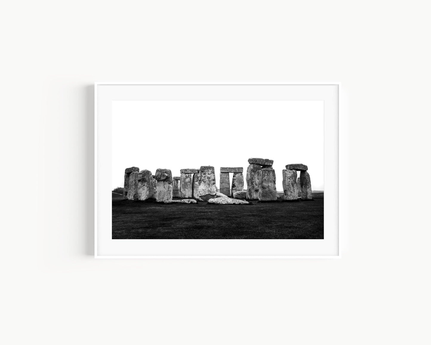 Black and white horizontal photo of Stonehenge with ancient stones against a cloudy sky – minimal neutral wall art