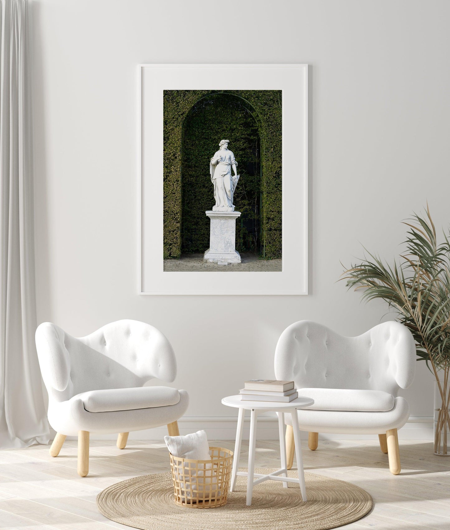 Color photograph of a marble statue in the gardens of the Palace of Versailles, framed by manicured green hedges and soft natural light — ideal for French wall decor, baroque decor, or art for hotel Airbnb.