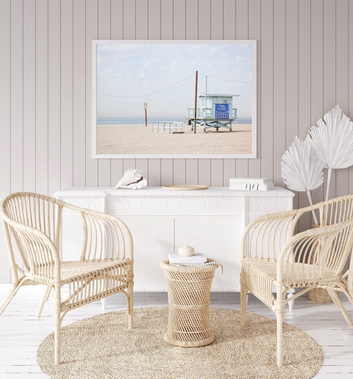 Lifeguard tower on Santa Monica Beach with soft sand and blue sky – coastal California photography print.