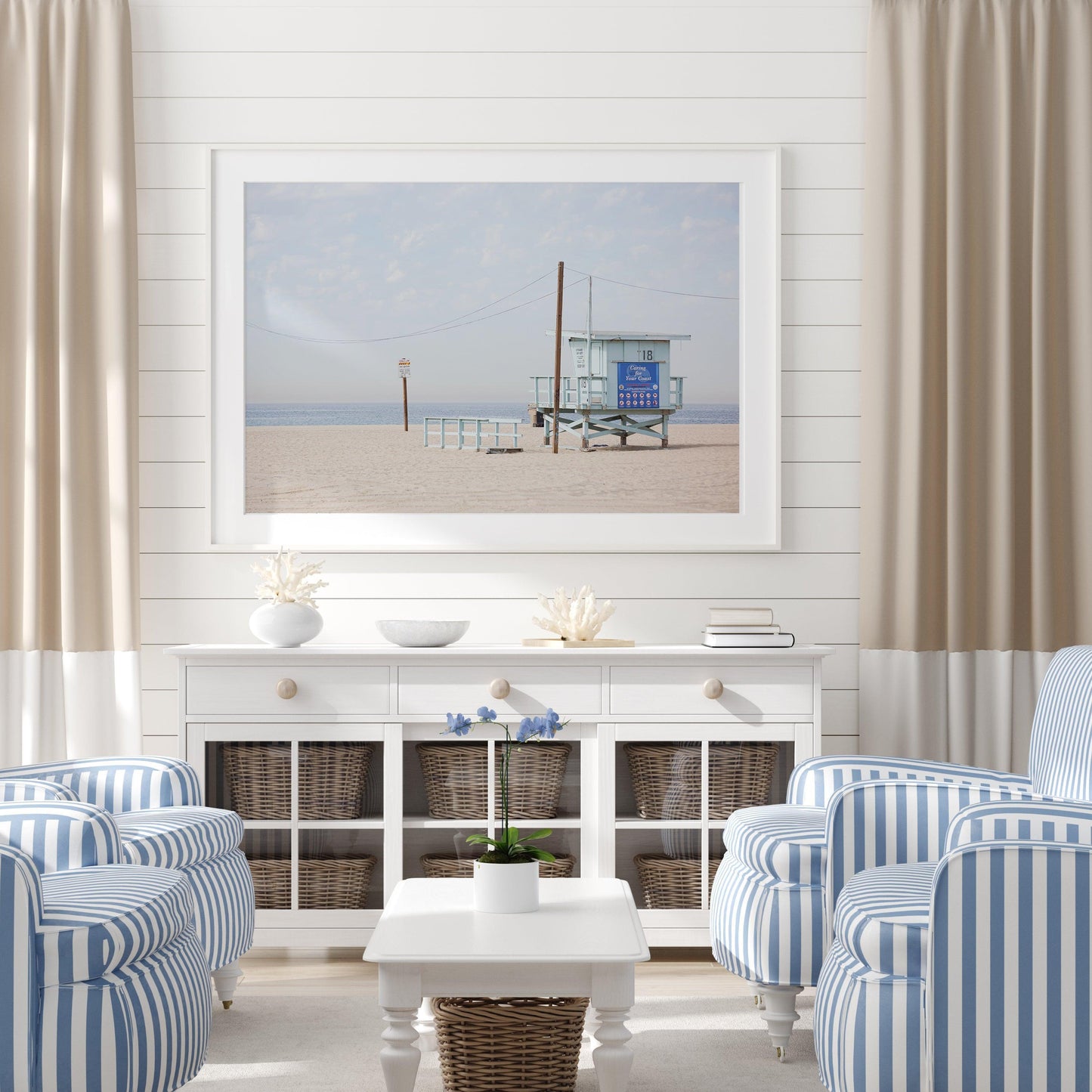 Lifeguard tower on Santa Monica Beach with soft sand and blue sky – coastal California photography print.