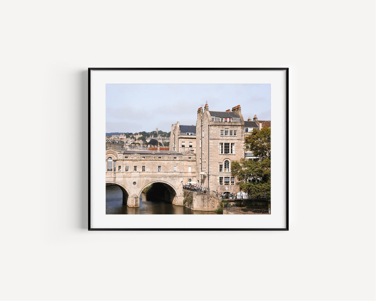 Color photograph of Pulteney Bridge in Bath, England, with historic stone buildings and the River Avon