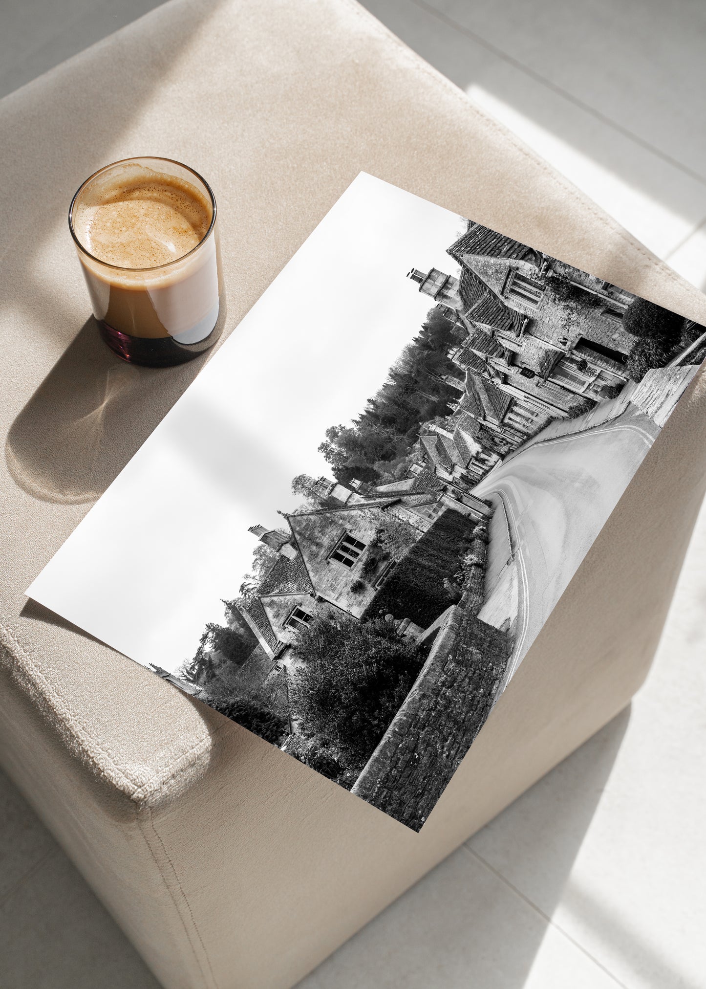 Black and white photo of Castle Combe village in the Cotswolds with old stone cottages and winding road – English countryside wall art.
