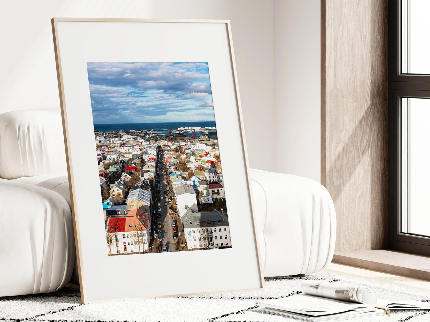 Colorful Reykjavik skyline on a clear day, showing a Nordic cityscape with vibrant rooftops, downtown buildings, and the North Atlantic in the background. Vertical Iceland photography print.