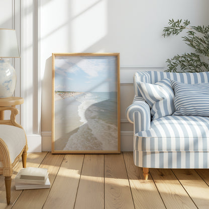Vertical beach photograph of Tybee Island, Georgia with gentle ocean waves, soft sand, and scattered beachgoers on a bright summer day – coastal Georgia wall art.
